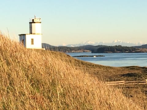 Cattle Point light house with Cascade range in the background