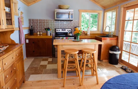 Full kitchen with electric range and convection microwave oven.