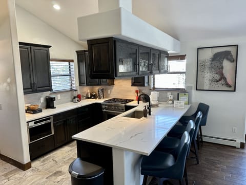 Renovated fully stocked kitchen with Thermador Appliances with gas stove 