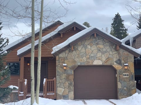 Front of house with one car garage and one car can fit in the driveway