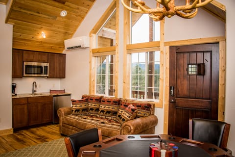 The addition has sink, microwave, TV, queen sleeper sofa, 3-in-1 game table  