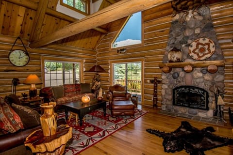 Living area, open to the dining area to the right of the fireplace