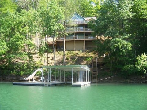 Back Exterior of Home, Cov Dock, 2 Personal Watercraft Lifts and Water Slide