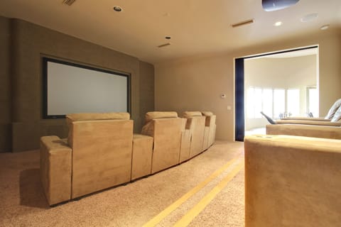 Large projection screen theater room.