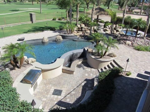 Your own resort-heated pool, water features, heated spa and tiki on golf course.