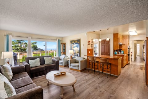 The large den is open to the kitchen and perfect for friends and family.