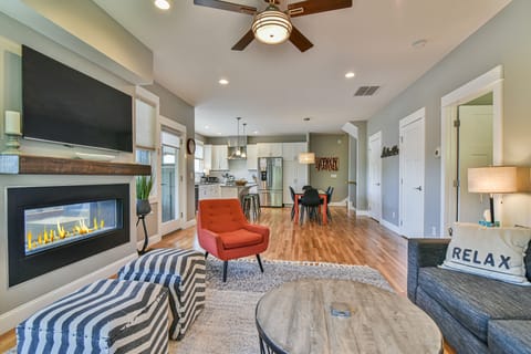 Modern living room with fireplace and comfortable seating. Perfect for relaxing.