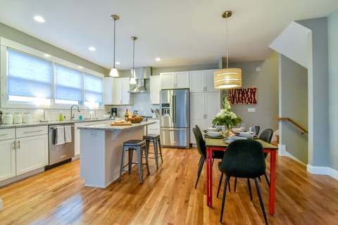 Open-concept living space with modern kitchen and dining area.