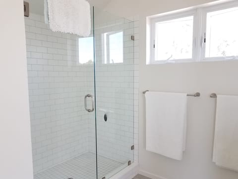 Combined shower/tub, hair dryer, towels, soap