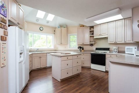 The spacious kitchen is fully equipped with all of the conveniences of home.