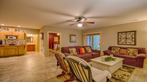 View of lower level living room with wet bar.
