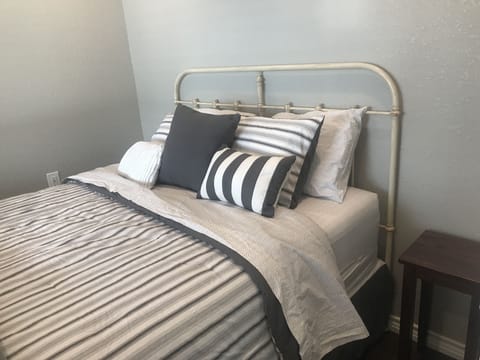 Third bedroom with queen bed on ground floor