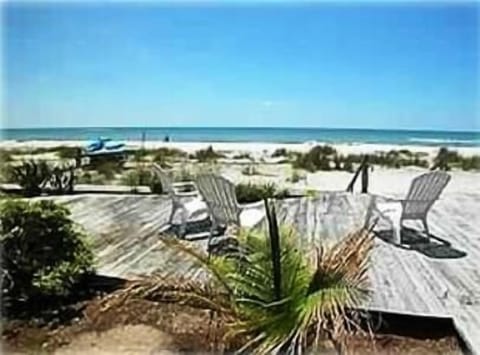 On the beach, sun loungers, beach towels