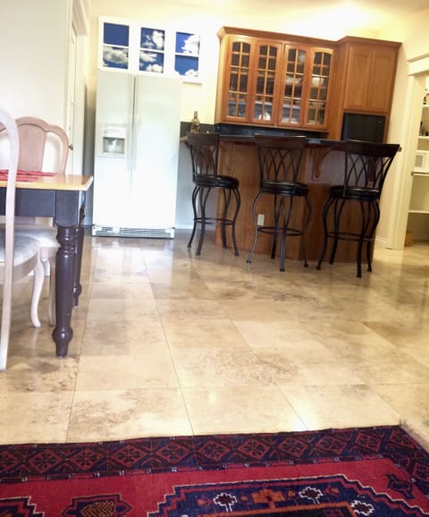 Kitchenette, full size frig/freezer, raised counter stools, dining area to left