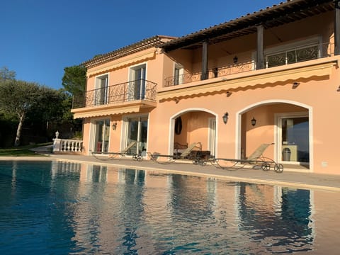 A heated pool, sun loungers