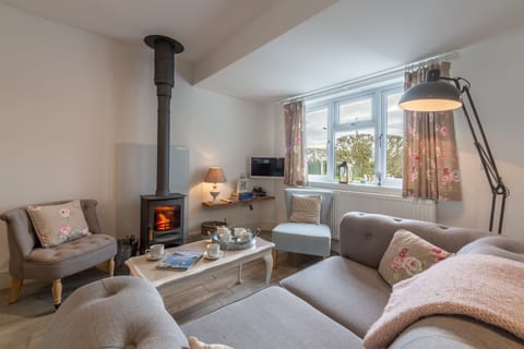Miss Fishers, Port Isaac. Ground floor: Sitting room with cosy wood burning stove
