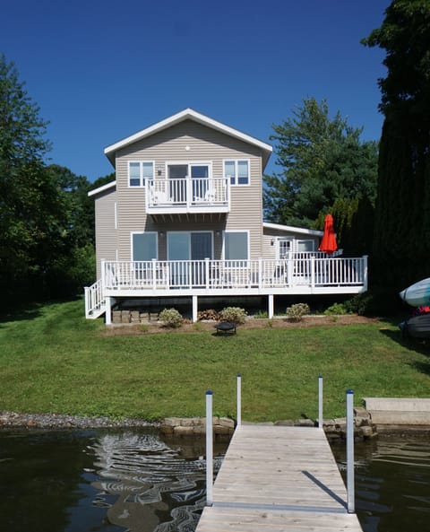 Beautiful yard with wrap around deck right on the lake.