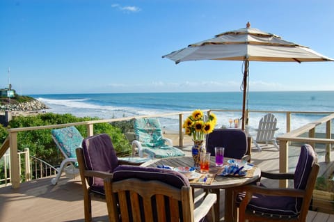 The beach is just a few steps away, but you won't want to leave this huge deck!