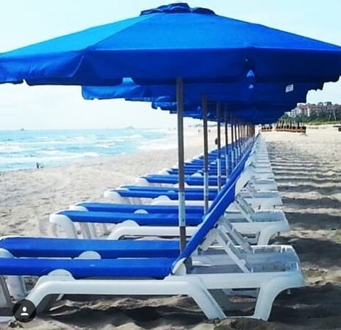 On the beach, sun loungers, beach towels