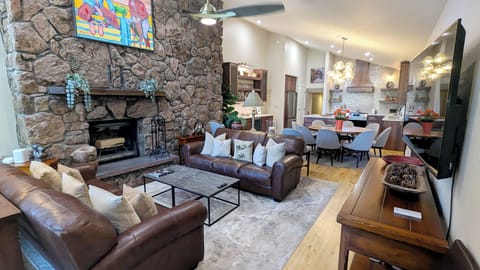 Beaver Creek West Condo #31 living room with wood fireplace and dining table
