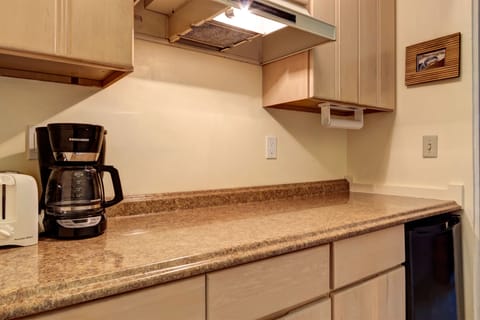 Breakfast bar with toaster, coffee maker, and blender.