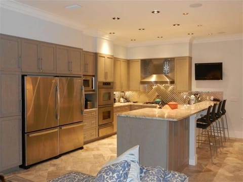 Two Refrigerators, Dacor Dbl ovens w/warming drawer, 5 burner gas cooktop w/hood