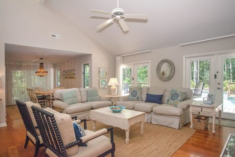 A comfortable family room overlooks the pool.