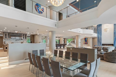 Dining room showcasing a stunning 14-person table, designed for hosting grand gatherings or intimate family meals in style.