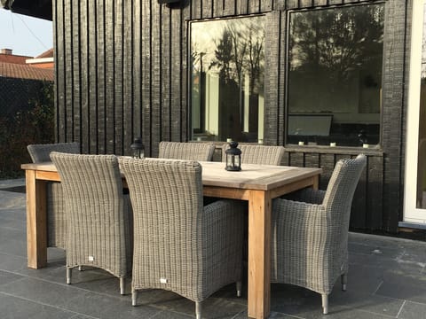 patio with teak outdoor furniture