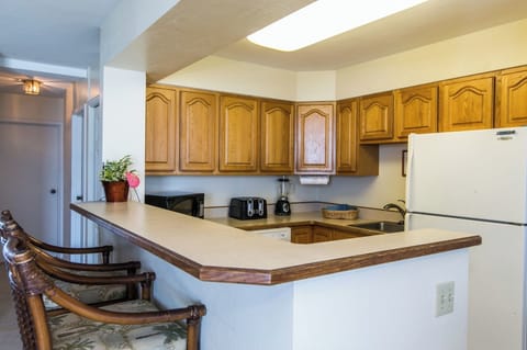 Breakfast bar in addition to dining table and lanai.
