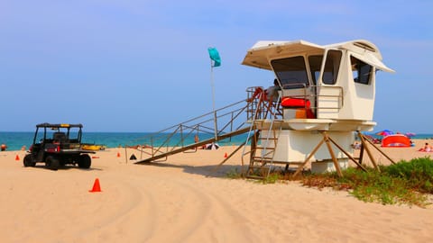 On the beach, sun loungers, beach towels