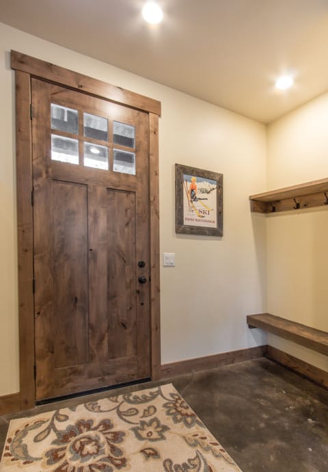Entryway stores coats, hats, gloves and boots. Adjacent closet (not shown).