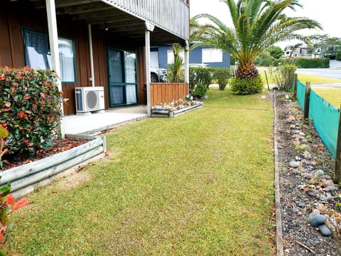 Front of house with access from bedroom 2 via sliding door.