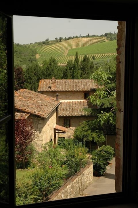 View from window looking out over village and hillside