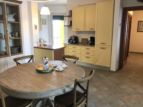 Open Kitchen and Dining Area, small service balcony beyond