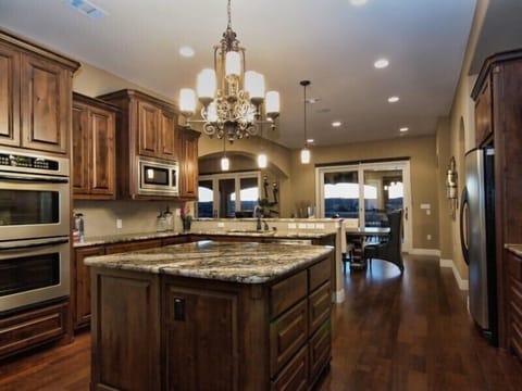 BEAUTIFUL KITCHEN WITH 2 CONVECTION OVENS, GAS STOVE, MICROWAVE OVEN & 2 REFRIG.