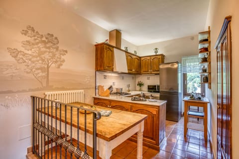 Well-appointed, high-end appliances and cookware. Another mural by local artist!