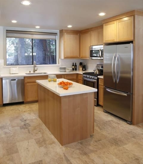 Fully equipped kitchen with beverage fridge under island