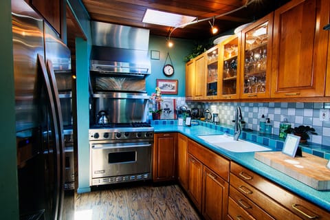 Gourmet kitchen. Viking range/oven, cherry cabinetry, copper pots, fully stocked