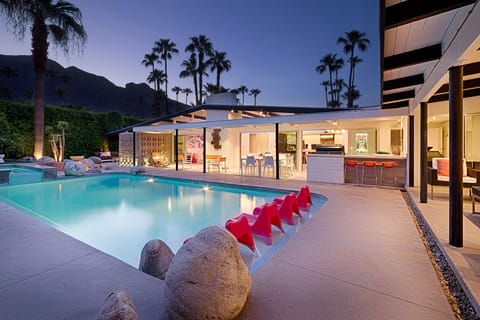 Pool and outdoor patios at dusk