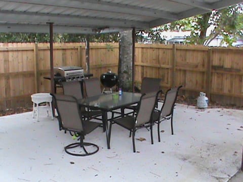 Outdoor seating-2 w/ metal cover with lighting, gas grill for use & charcoal pit