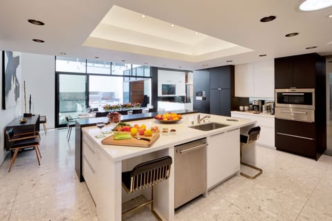 View from kitchen to dining. Huge island with seating, Wolf/SubZero appliances