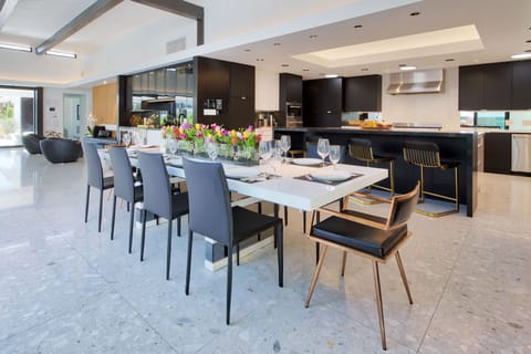 Dining with Kitchen and Lounge/Bar behind. Wine fridge, Bev center, Ice Maker