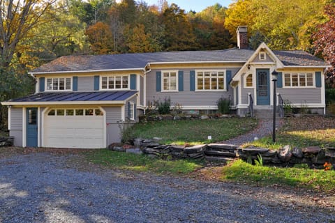 Older photo showing house in early fall, before walls & driveway redone.

