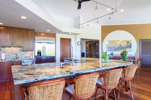 The kitchen has seating for four at the bar counter