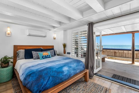 Master bedroom with ocean view, opens to lower deck