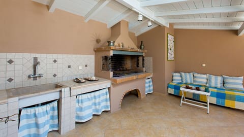 Fully equipped barbecue area outdoors next to the pool area