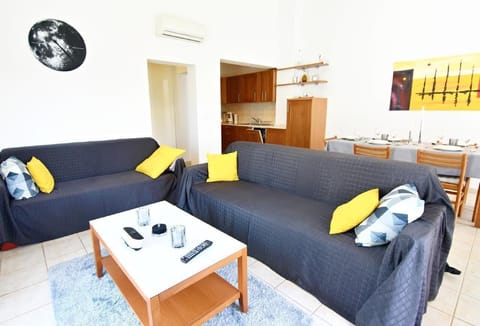 The living area with coffee table, sofa and sofa bed