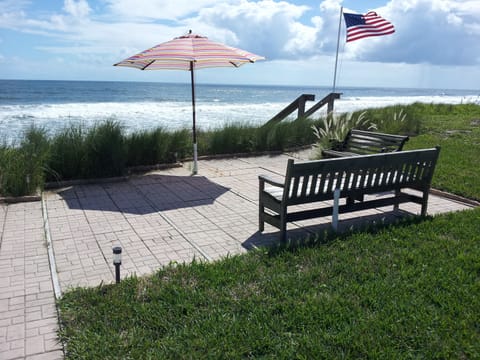 Enjoy the patio overlooking the beach, just a few steps to the sand below!