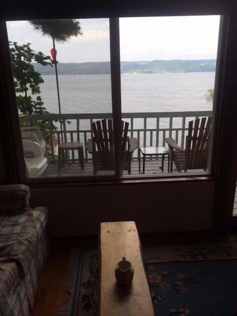 The large sliding windows in the sitting room offer a great view of the lake.